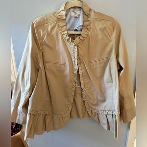 Cute tan jacket with lots of ruffles